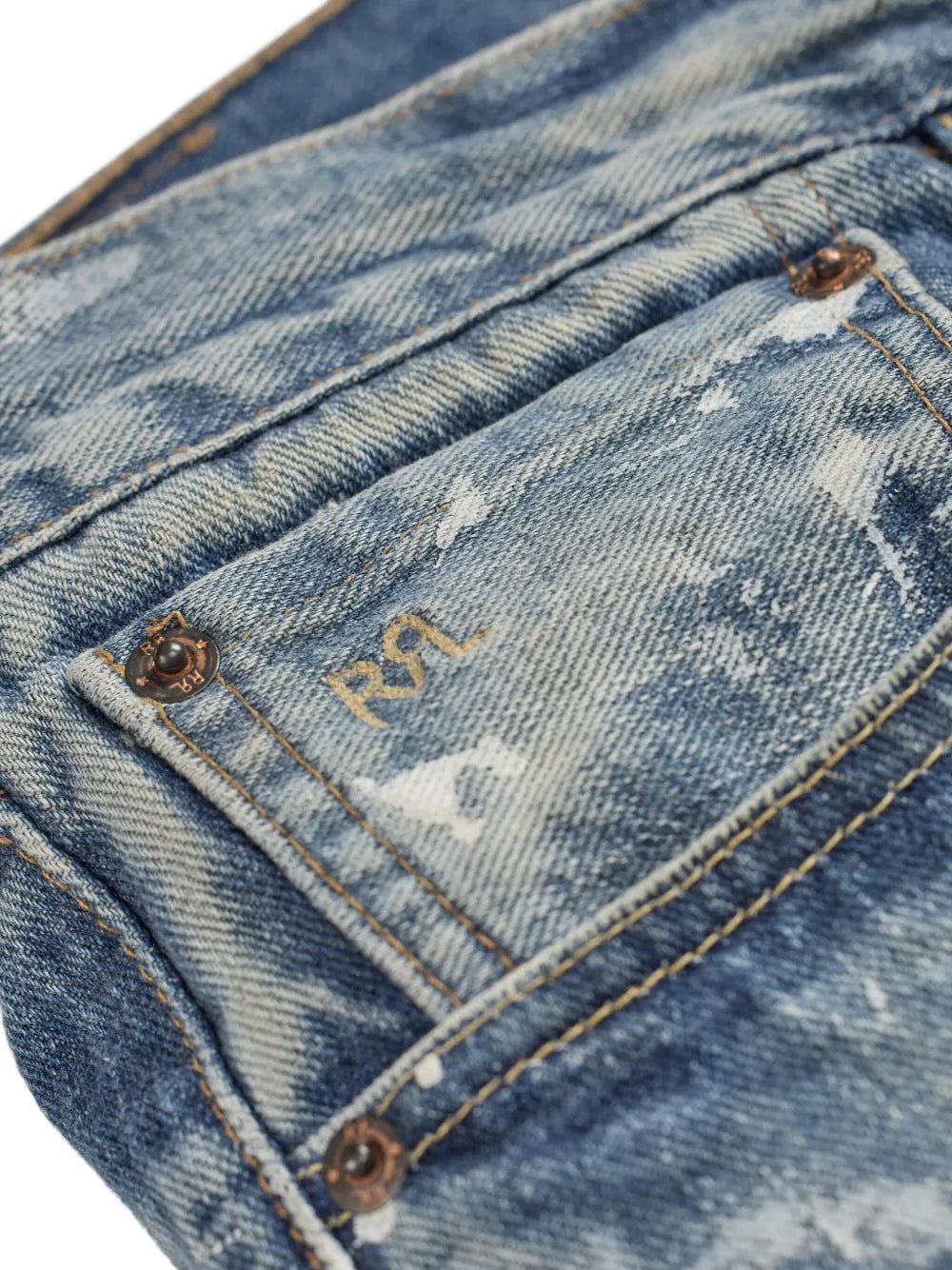 paint-splattered jeans