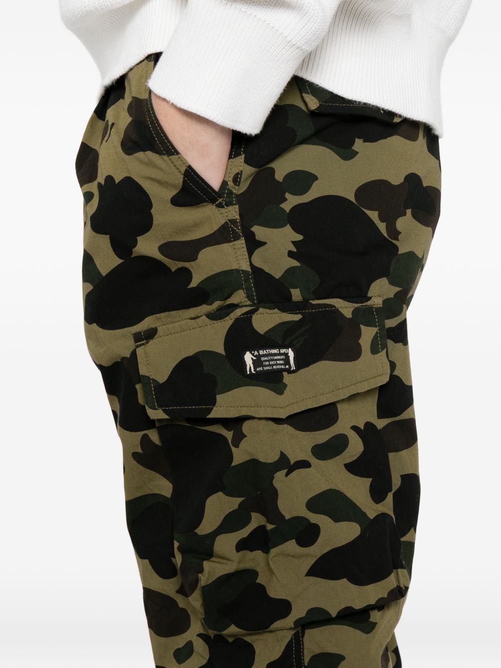 camouflage-print trousers